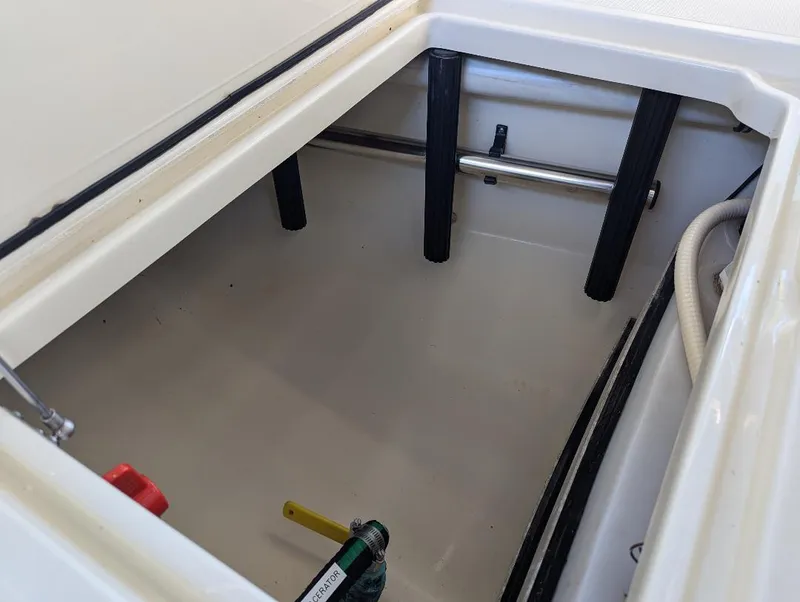 Slide: The Image of Storage compartment of 2015 Chris-Craft Catalina 29 boat, featuring clean interior and visible components. - 16