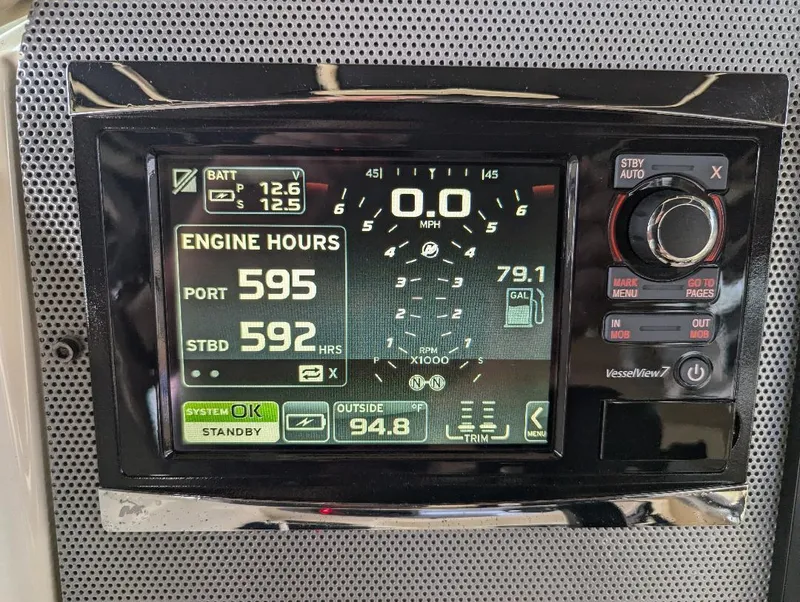 Slide: The Image of Dashboard display of a 2015 Chris-Craft Catalina 29 showing engine hours and speedometer. - 20