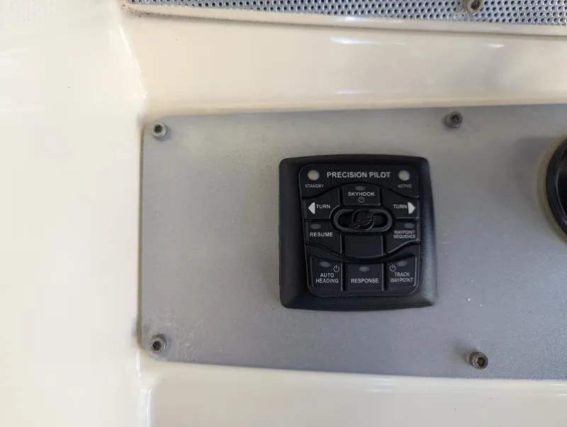 Slide: The Image of Control panel on a 2015 Chris-Craft Catalina 29 boat, featuring Precision Pilot system. - 21