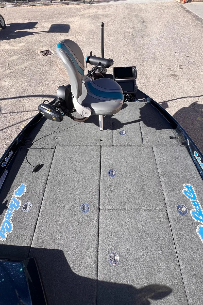 Slide: The Image of 2021 Bass Cat Caracal boat deck with fishing seat and equipment. - 10