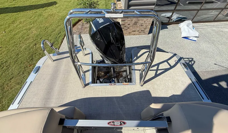 Slide: The Image of Harris Cruiser 250 CWDH 2025 with outboard motor on boat deck. - 18