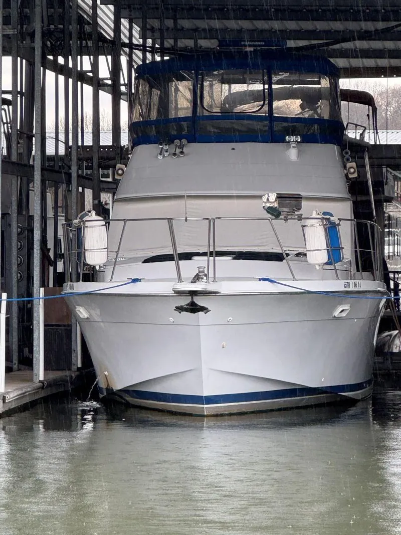 The Image of 1988 Chris-Craft 426 Catalina yacht docked in a marina, front view. - 1