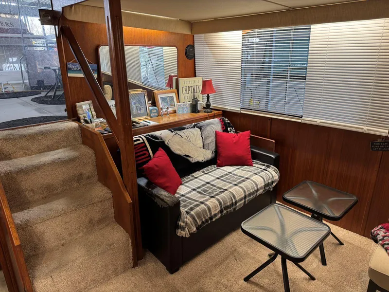 Slide: The Image of Cozy interior of 1988 Chris-Craft 426 Catalina with sofa, decor, and carpeted stairs. - 20