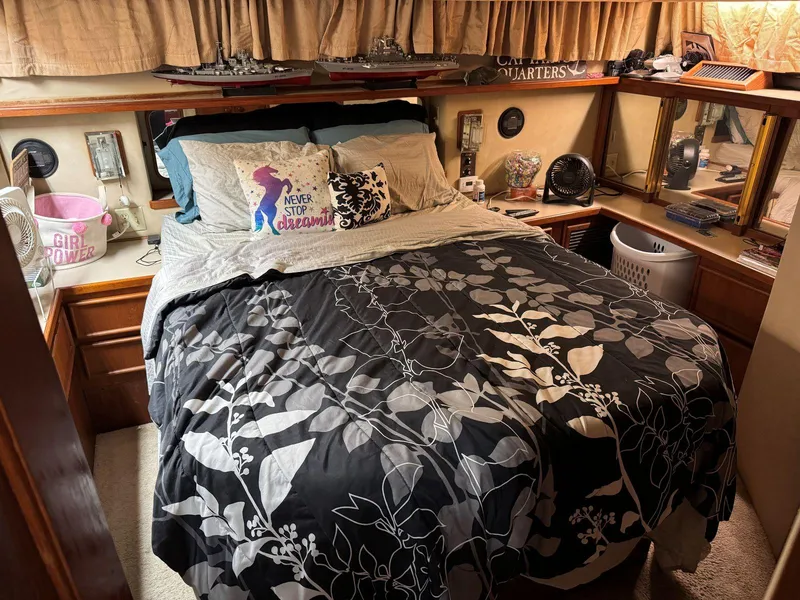Slide: The Image of Cozy bedroom in 1988 Chris-Craft 426 Catalina yacht with floral bedding and decorative pillows. - 41