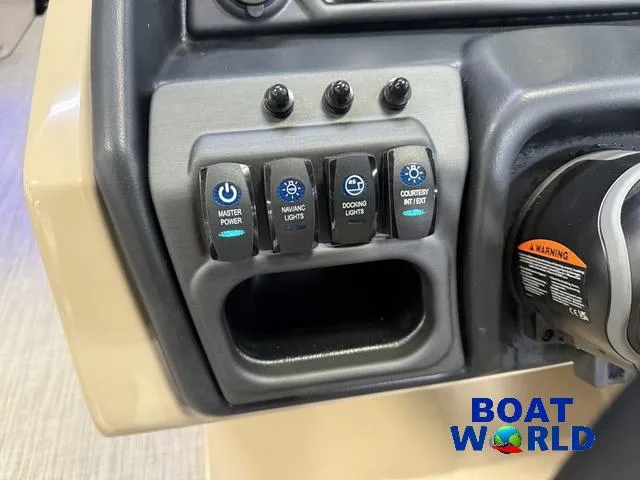 Slide: The Image of Control panel of 2025 Bentley Pontoons Legacy 223 Navigator Tritoon, featuring various switches. - 14
