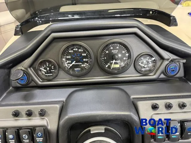 Slide: The Image of Dashboard of 2025 Bentley Pontoons Legacy 223 Navigator Tritoon, featuring gauges and controls. - 15