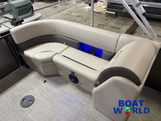 Slide: The Image of 2025 Bentley Pontoons Legacy 223 Navigator Quad Lounge interior with plush seating and ambient lighting. - 19