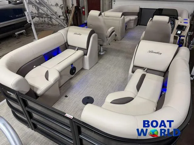 Slide: The Image of 2025 Bentley Pontoons Legacy 223 Navigator Quad Lounge Tritoon interior with plush seating. - 20