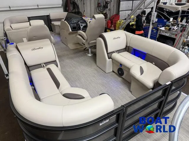 Slide: The Image of 2025 Bentley Pontoons Legacy 223 Navigator Quad Lounge Tritoon interior with luxurious seating and modern design. - 21
