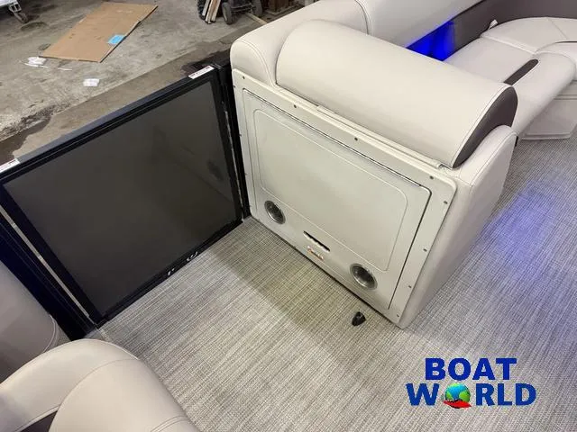 Slide: The Image of 2025 Bentley Pontoons Legacy 223 Navigator interior with lounge seating and entertainment system. - 24
