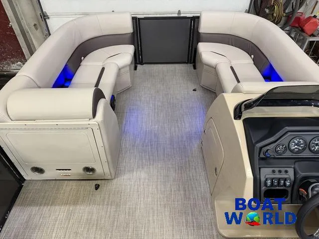 Slide: The Image of 2025 Bentley Pontoons Legacy 223 Navigator interior with quad lounge seating and modern dashboard. - 26