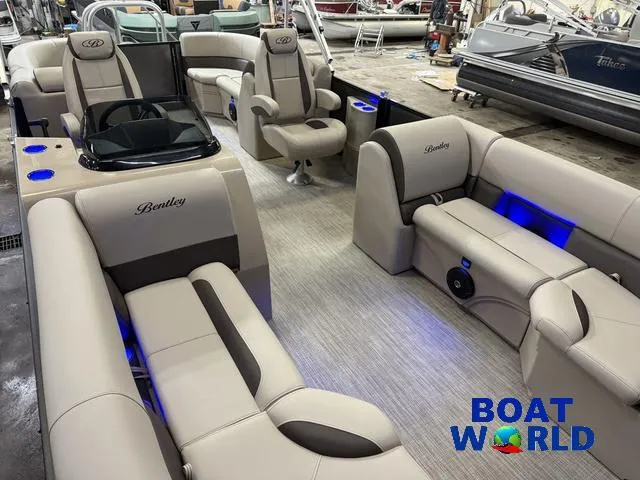Slide: The Image of 2025 Bentley Pontoons Legacy 223 Navigator Quad Lounge Tritoon interior with luxurious seating and ambient lighting. - 31