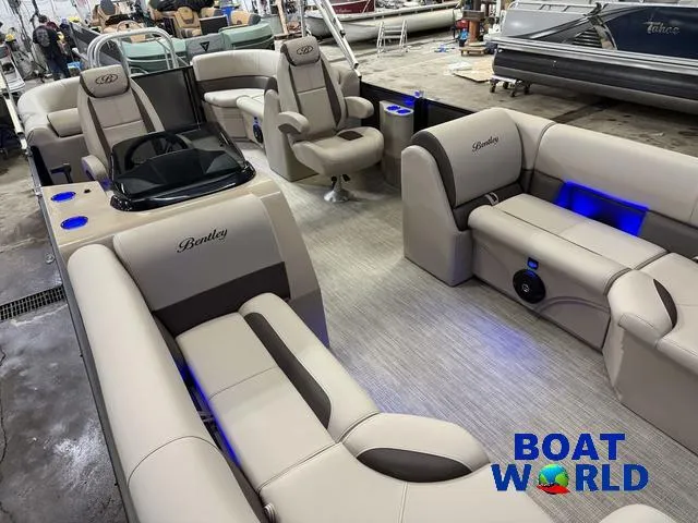 Slide: The Image of 2025 Bentley Pontoons Legacy 223 Navigator Quad Lounge Tritoon interior with luxurious seating and ambient lighting. - 32