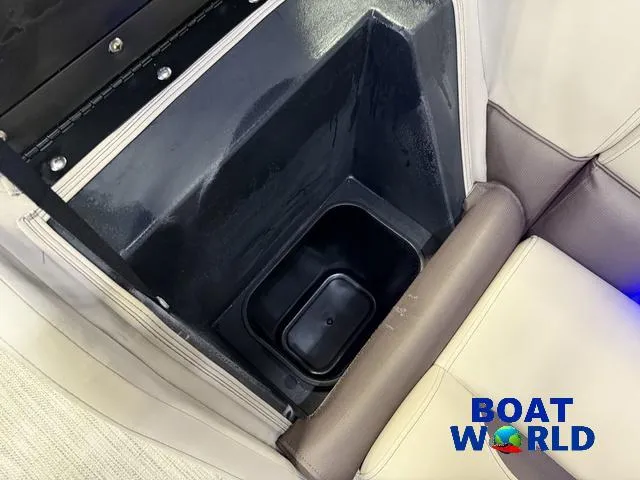 Slide: The Image of Storage compartment in 2025 Bentley Pontoons Legacy 223 Navigator Tritoon, featuring beige seating. - 33