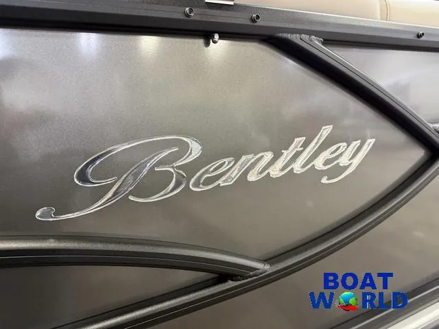 Slide: The Image of 2025 Bentley Pontoons Legacy 223 Navigator Tritoon, close-up of logo, Boat World branding. - 38