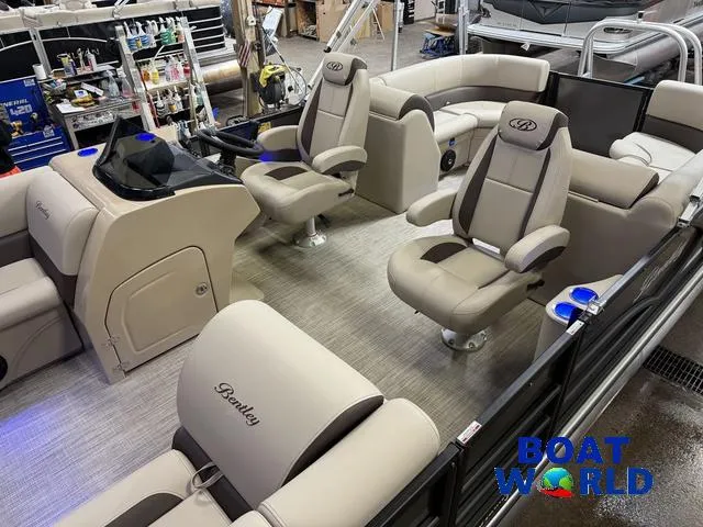 Slide: The Image of 2025 Bentley Pontoons Legacy 223 Navigator Quad Lounge Tritoon interior with luxurious seating. - 4