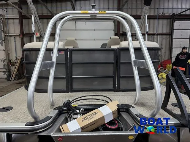 Slide: The Image of 2025 Bentley Pontoons Legacy 223 Navigator Quad Lounge Tritoon in a warehouse setting. - 43