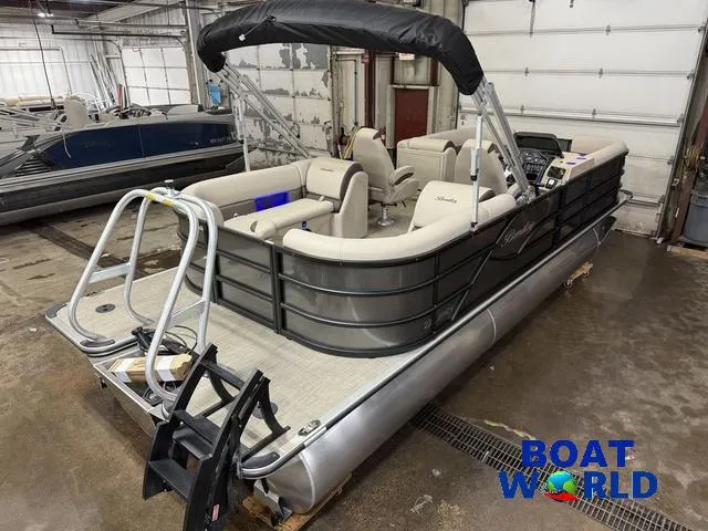 Slide: The Image of 2025 Bentley Pontoons Legacy 223 Navigator Quad Lounge Tritoon in a showroom. - 49