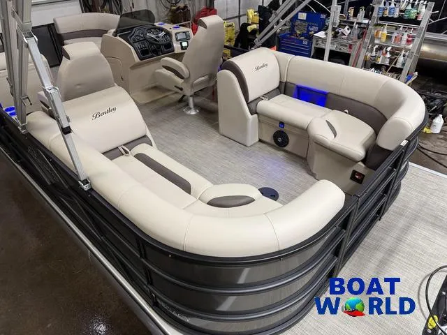 Slide: The Image of 2025 Bentley Pontoons Legacy 223 Navigator Quad Lounge Tritoon interior with luxurious seating. - 5