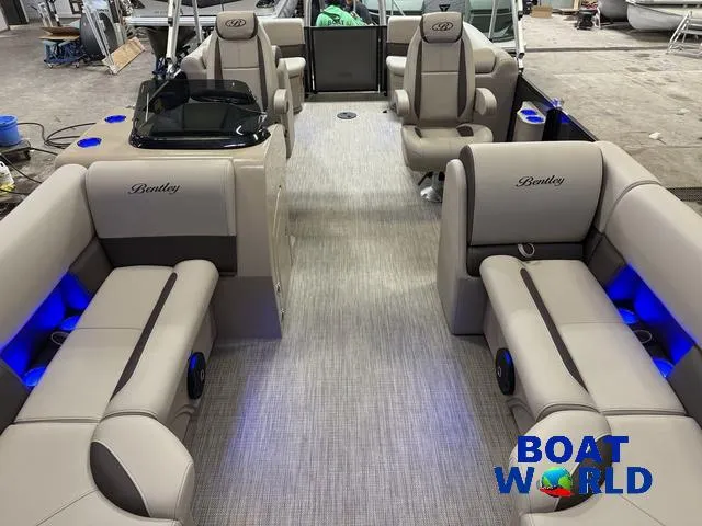 Slide: The Image of 2025 Bentley Pontoons Legacy 223 Navigator Quad Lounge Tritoon interior with luxurious seating. - 7