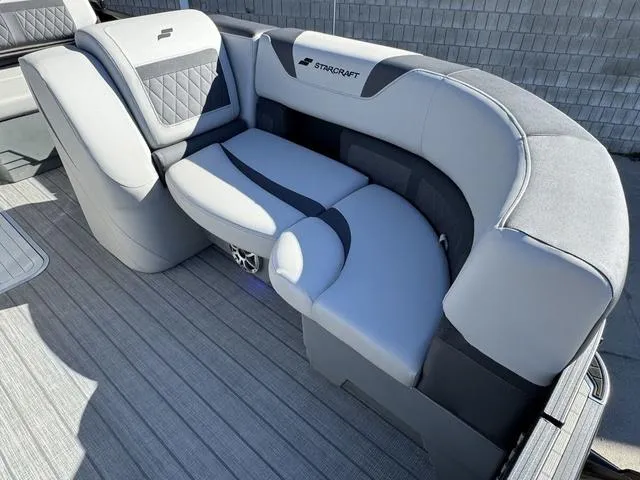 Slide: The Image of 2025 Starcraft CX 23 RL boat dashboard with steering wheel, gauges, and digital display. - 10