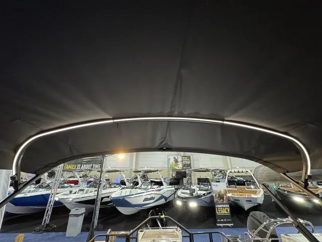 Slide: The Image of Dashboard of 2025 Starcraft CX 23 RL boat with illuminated gauges. - 11