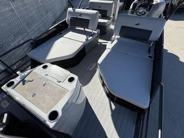 Slide: The Image of Control panel of 2025 Starcraft CX 23 RL boat with various function buttons. - 16