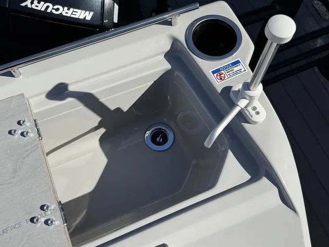 Slide: The Image of Starcraft CX 23 RL 2025 boat sink with faucet and cup holder, featuring Mercury engine. - 19
