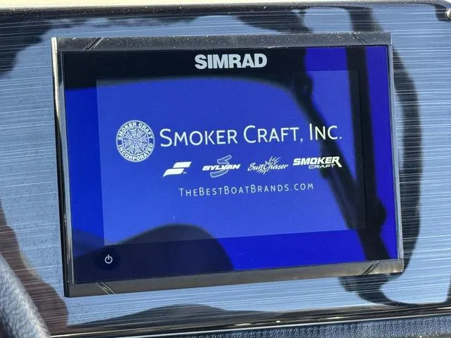 Slide: The Image of Simrad display on 2025 Starcraft CX 23 RL boat showing Smoker Craft, Inc. logo. - 26