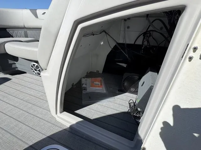 Slide: The Image of Interior view of 2025 Starcraft CX 23 RL boat storage compartment. - 29