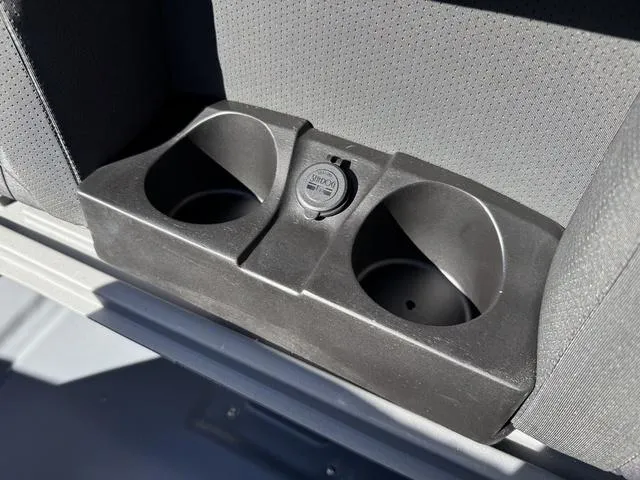 Slide: The Image of Cup holders and power outlet in 2025 Starcraft CX 23 RL boat interior. - 34