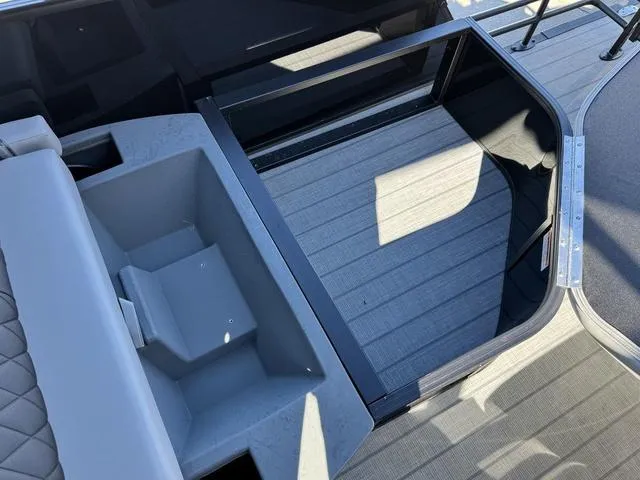 Slide: The Image of 2025 Starcraft CX 23 RL boat interior with seating and storage compartments. - 37