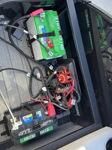 Slide: The Image of Battery compartment of 2025 Starcraft CX 23 RL with wiring and components. - 38