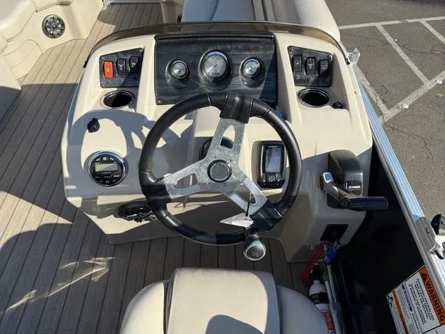 Slide: The Image of 2017 Bennington 20SLMX boat dashboard with steering wheel and controls. - 4