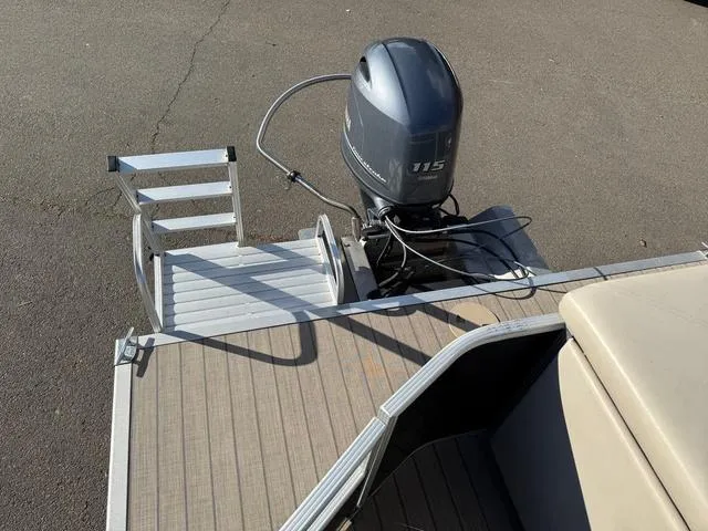 Slide: The Image of 2017 Bennington 20SLMX pontoon boat with outboard motor and swim ladder. - 6