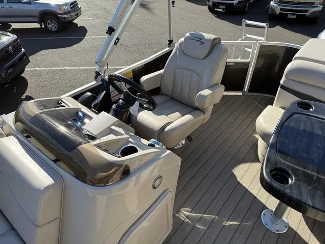 Slide: The Image of 2017 Bennington 20SLMX boat interior with steering console and seating area. - 8