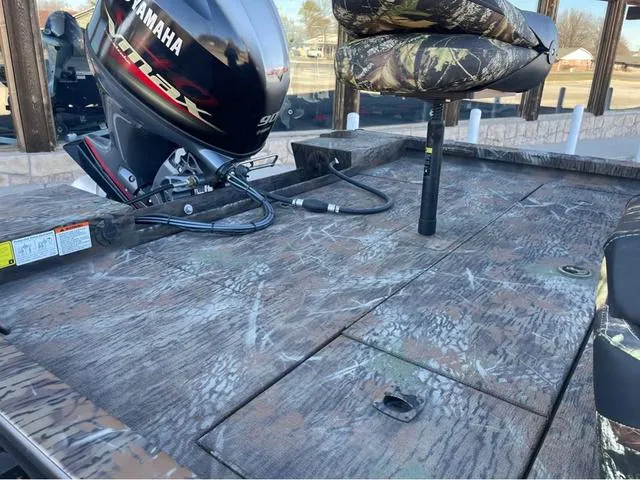 Slide: The Image of 2022 G3 Sportsman 1710 boat with Yamaha motor, camo seats, and textured deck. - 10