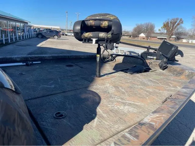 Slide: The Image of 2022 G3 Sportsman 1710 boat deck with camo seat and Minn Kota trolling motor. - 11