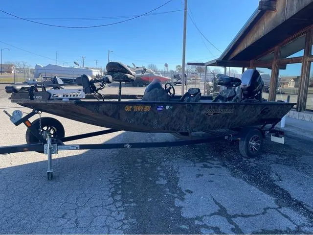 Slide: The Image of 2022 G3 Sportsman 1710 boat on trailer, parked outdoors. - 2