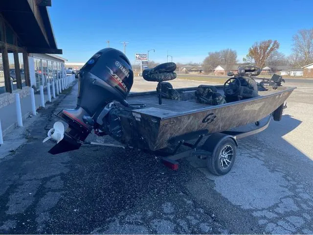 Slide: The Image of 2022 G3 Sportsman 1710 boat with Yamaha outboard motor, parked outdoors. - 3