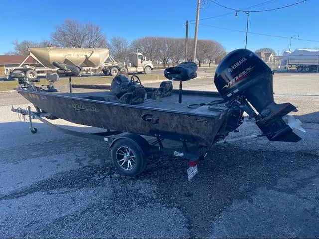 Slide: The Image of 2022 G3 Sportsman 1710 boat with Yamaha outboard motor, parked on a trailer. - 4