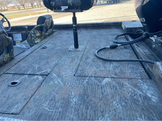 Slide: The Image of 2022 G3 Sportsman 1710 boat interior with camo seats and deck. - 5