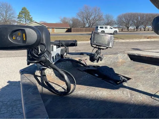 Slide: The Image of 2022 G3 Sportsman 1710 boat with trolling motor and fish finder, parked outdoors. - 8