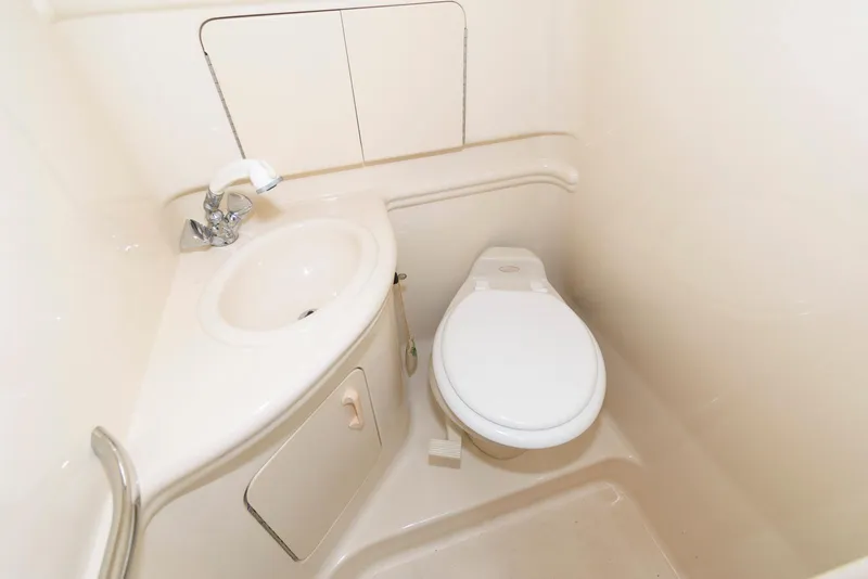 Slide: The Image of 2005 Sea Ray 280 Sundancer bathroom with sink and toilet. - 16