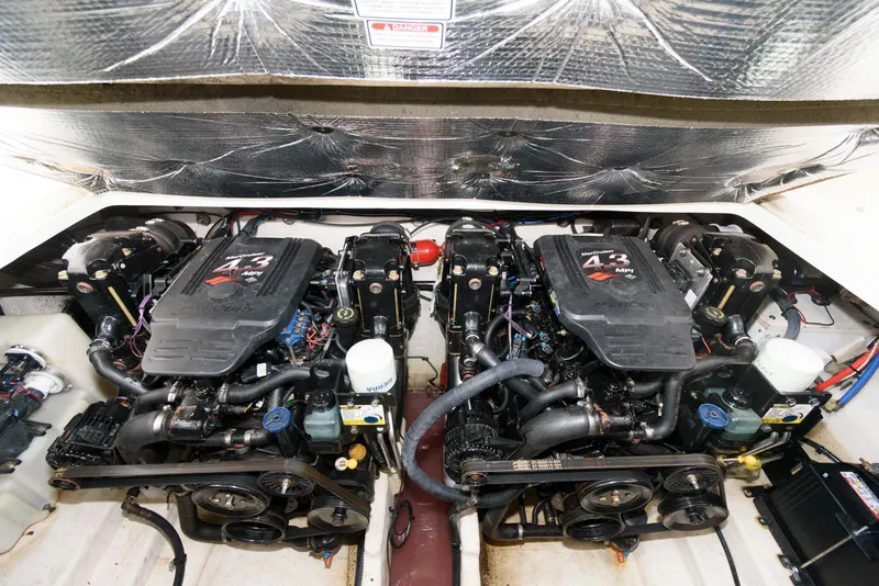 Slide: The Image of Engine compartment of a 2005 Sea Ray 280 Sundancer with dual 4.3L engines. - 17