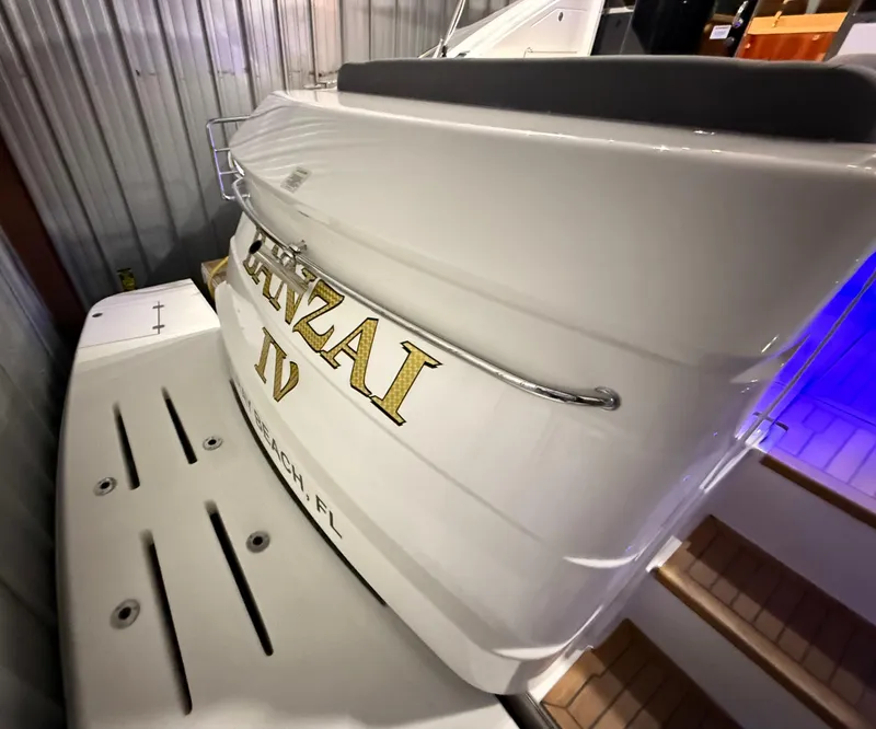 Slide: The Image of 2019 Riviera 4800 Sport Yacht in storage, featuring sleek design and elegant lettering. - 11