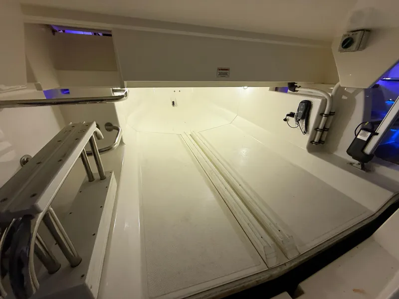 Slide: The Image of Interior view of 2019 Riviera 4800 Sport Yacht, showcasing spacious storage area. - 12