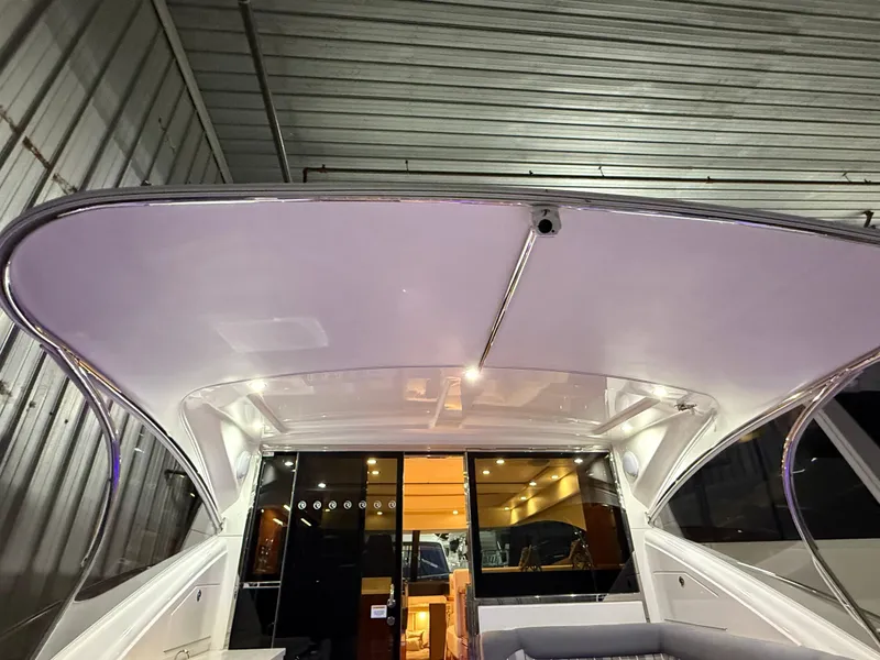 Slide: The Image of 2019 Riviera 4800 Sport Yacht interior view with sleek design and modern lighting. - 28