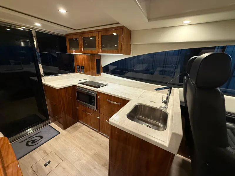 Slide: The Image of Luxurious kitchen interior of 2019 Riviera 4800 Sport Yacht with modern amenities. - 35