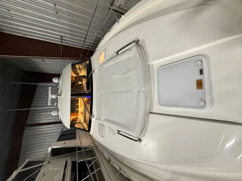 Slide: The Image of 2019 Riviera 4800 Sport Yacht in a storage facility, showcasing sleek design and luxury features. - 4